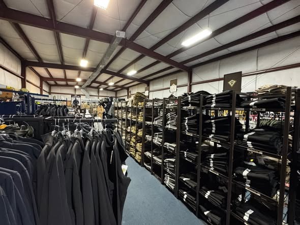 TruBlu Tactical store aisle with uniforms and outerwear